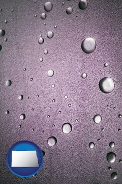 water droplets on a shower door - with North Dakota icon