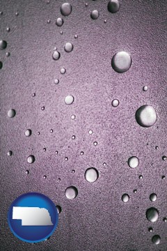 water droplets on a shower door - with Nebraska icon