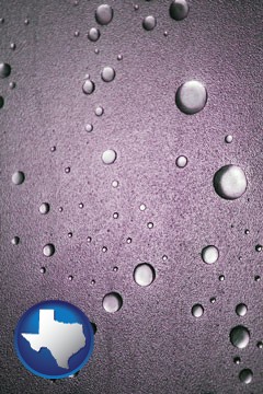 water droplets on a shower door - with Texas icon