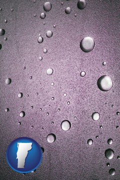 water droplets on a shower door - with Vermont icon