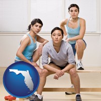 fl map icon and three athletes wearing sportswear