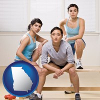 ga map icon and three athletes wearing sportswear
