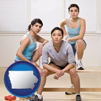 iowa map icon and three athletes wearing sportswear