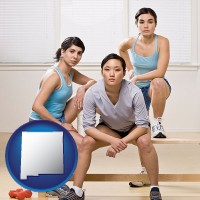 nm map icon and three athletes wearing sportswear