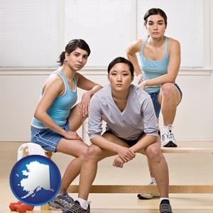 three athletes wearing sportswear - with Alaska icon