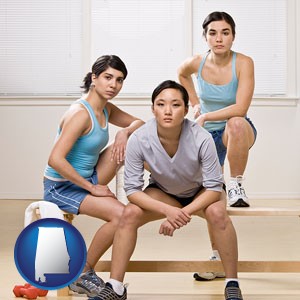 three athletes wearing sportswear - with Alabama icon