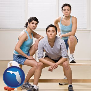 three athletes wearing sportswear - with Florida icon