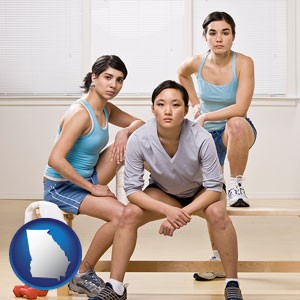 three athletes wearing sportswear - with Georgia icon