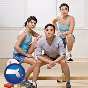 three athletes wearing sportswear - with Massachusetts icon