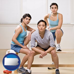 three athletes wearing sportswear - with Pennsylvania icon
