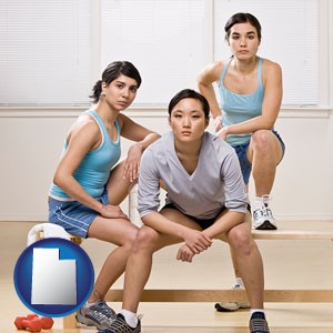 three athletes wearing sportswear - with Utah icon