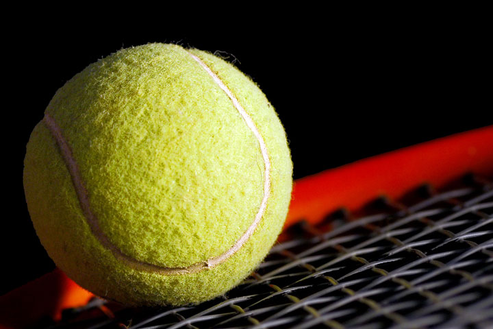 a yellow tennis ball and tennis racket (large image)
