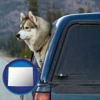 wyoming map icon and a truck cap and a Siberian husky