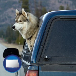 a truck cap and a Siberian husky - with North Dakota icon