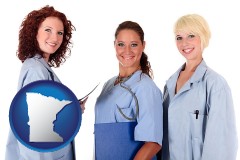 minnesota three female doctors wearing hospital uniforms