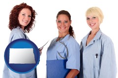 north-dakota three female doctors wearing hospital uniforms