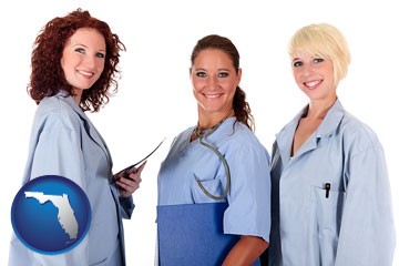 three female doctors wearing hospital uniforms - with Florida icon
