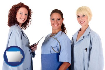 three female doctors wearing hospital uniforms - with Iowa icon