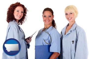three female doctors wearing hospital uniforms - with Montana icon
