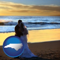 north-carolina map icon and a beach wedding at sunset