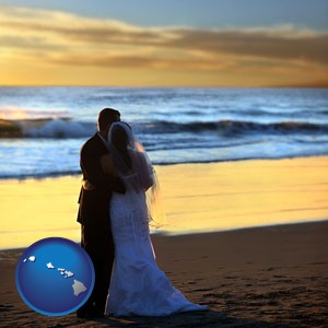 a beach wedding at sunset - with Hawaii icon