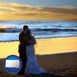 a beach wedding at sunset - with South Dakota icon