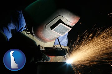 a welder using welding equipment - with Delaware icon