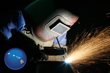 a welder using welding equipment - with Hawaii icon