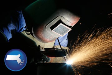 a welder using welding equipment - with Massachusetts icon