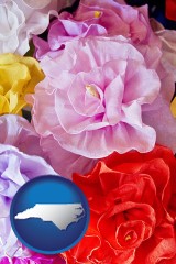 north-carolina map icon and artificial flowers