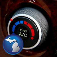 michigan map icon and an automobile air conditioner control knob