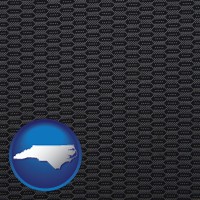 north-carolina map icon and a gray car upholstery sample