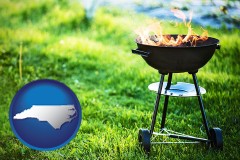 north-carolina map icon and a round barbecue grill
