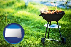 south-dakota map icon and a round barbecue grill