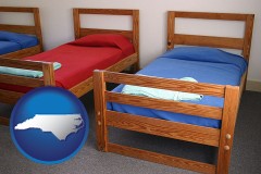 north-carolina map icon and summer camp beds