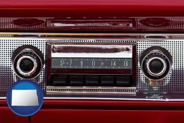 a vintage car radio - with North Dakota icon