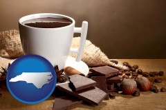 north-carolina map icon and a cup of hot chocolate