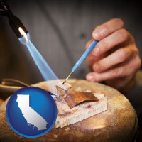california map icon and a goldsmith making a custom gold ring