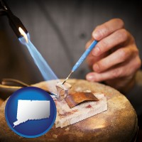connecticut map icon and a goldsmith making a custom gold ring