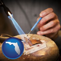 florida map icon and a goldsmith making a custom gold ring
