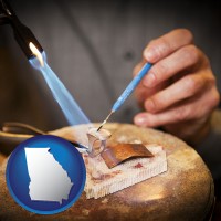 georgia map icon and a goldsmith making a custom gold ring