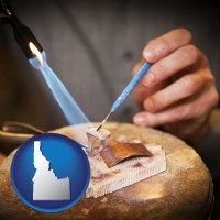 idaho map icon and a goldsmith making a custom gold ring