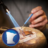 minnesota map icon and a goldsmith making a custom gold ring