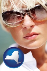 new-york map icon and a young woman wearing sunglasses