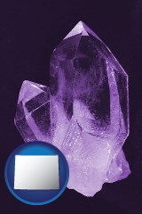 wyoming map icon and an amethyst gemstone