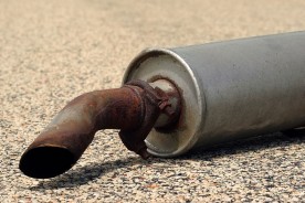 a rusty muffler and tailpipe