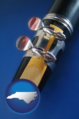 north-carolina map icon and a clarinet reed