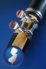 new-jersey map icon and a clarinet reed