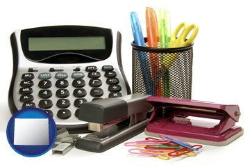 office supplies: calculator, paper clips, pens, scissors, stapler, and staples - with Wyoming icon