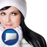 connecticut map icon and a woman wearing warm, white outerwear